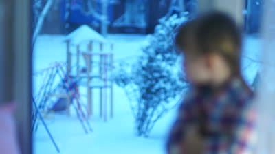 stock-footage-sad-girl-looking-in-window-at-the-snow-covered-playground-thumb-400x224-21445.jpg