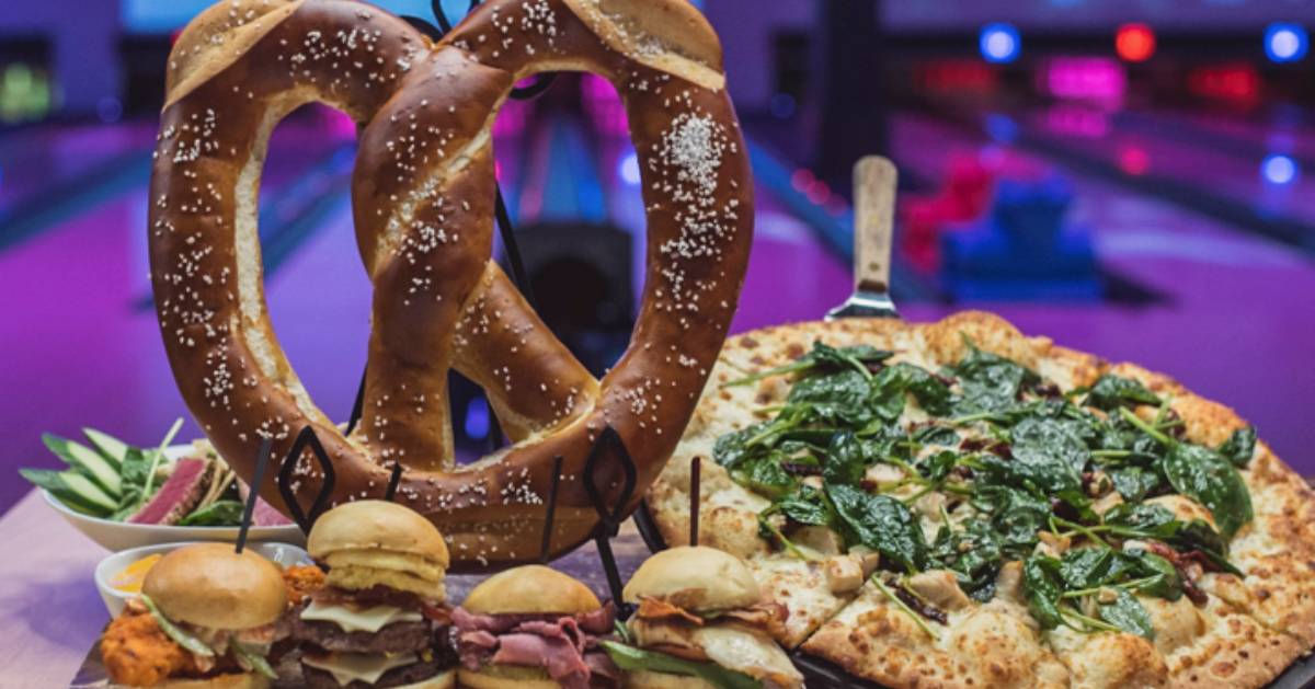 large pretzel and sliders and pizza