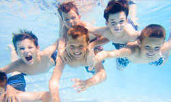 Boys Swimming At Adirondack Summer Camp